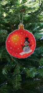 Orange snowman - stitched on plastic aida