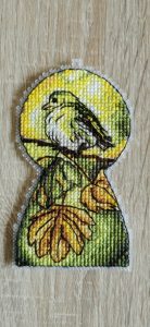 Yellow bird embroidery by Sestakova detail