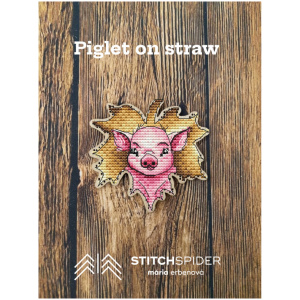 Piglet on straw on the wood