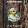 Duck on the lake on wood