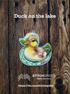 Duck on the lake on wood